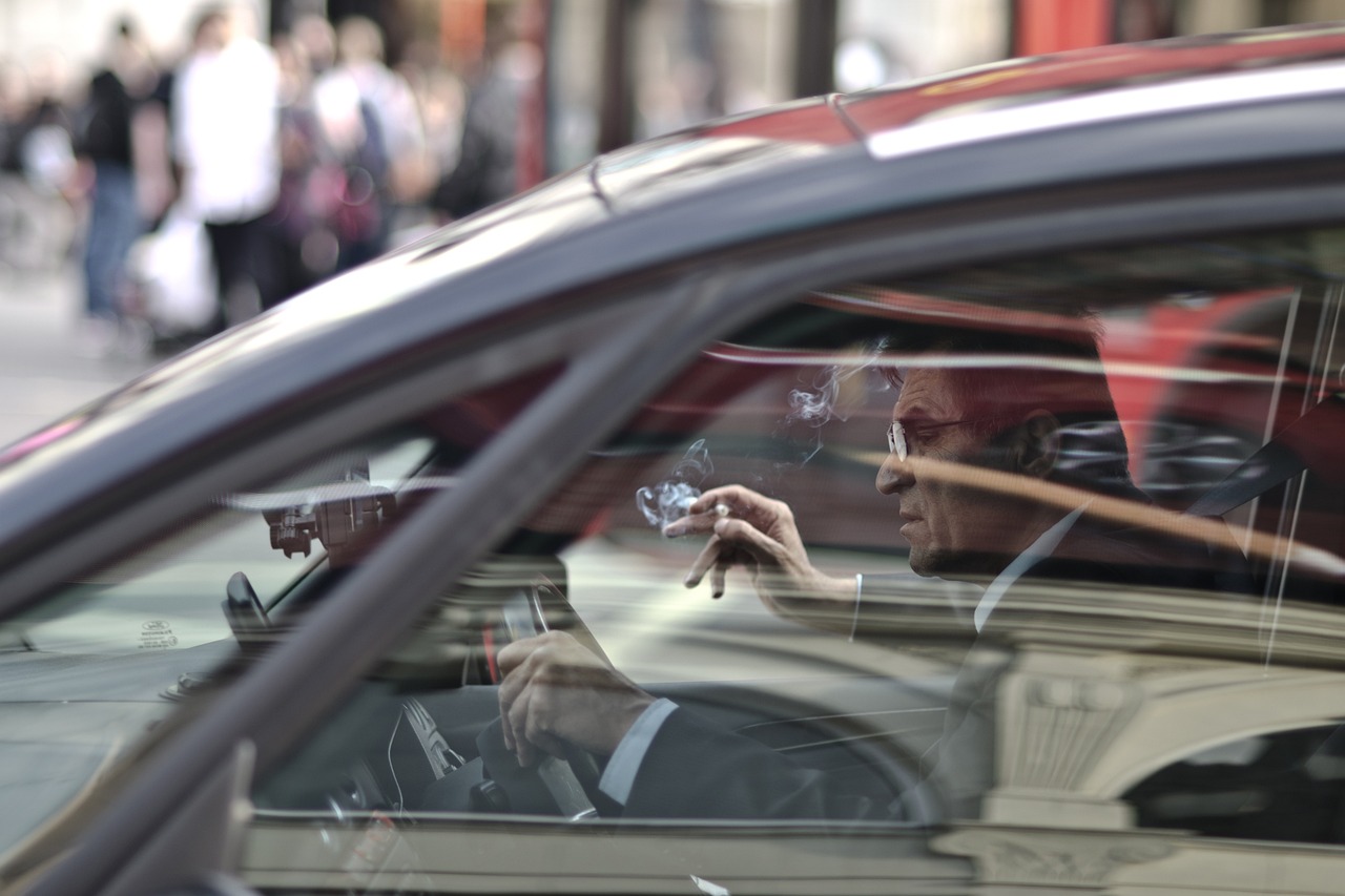 a driver is smoking while driving